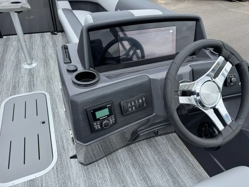 Slide: The Image of Interior of 2026 Bennington 23SSR SPS LTD TRI with steering wheel and console. - 30