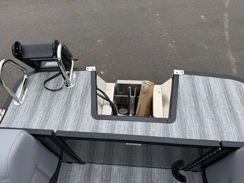 Slide: The Image of Bennington 23SSR SPS LTD TRI 2026 boat rear with storage compartment. - 35