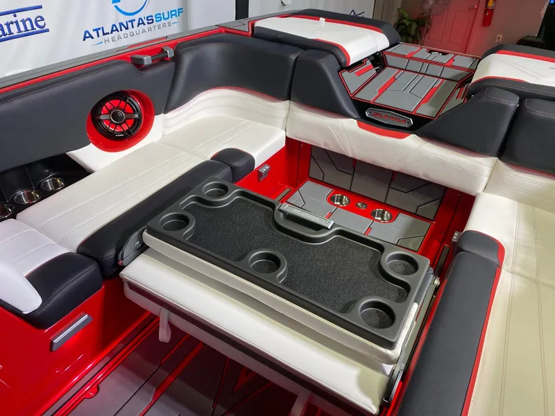 Slide: The Image of Interior of a 2021 Supra SL 400 with red and white seating. - 13