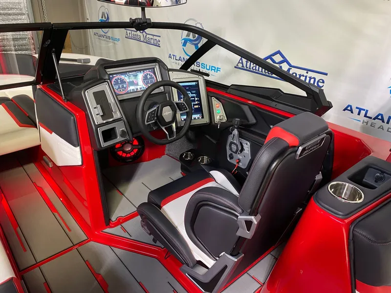 Slide: The Image of Interior of a 2021 Supra SL 400 boat with modern controls. - 15