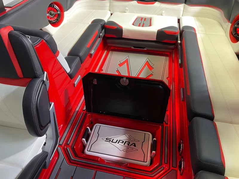 Slide: The Image of Interior of a 2021 Supra SL 400 with red and white accents. - 18