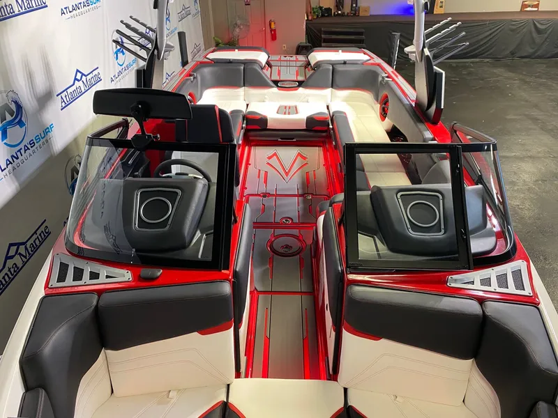 Slide: The Image of Interior view of a 2021 Supra SL 400 boat, red and white design. - 22