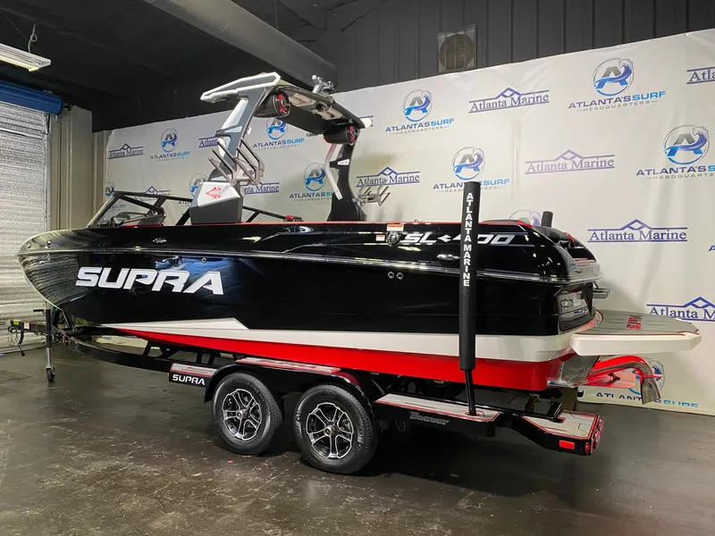 Slide: The Image of 2021 Supra SL 400 boat in a showroom. - 3