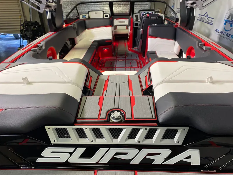Slide: The Image of Interior of a 2021 Supra SL 400 boat with luxurious seating. - 9