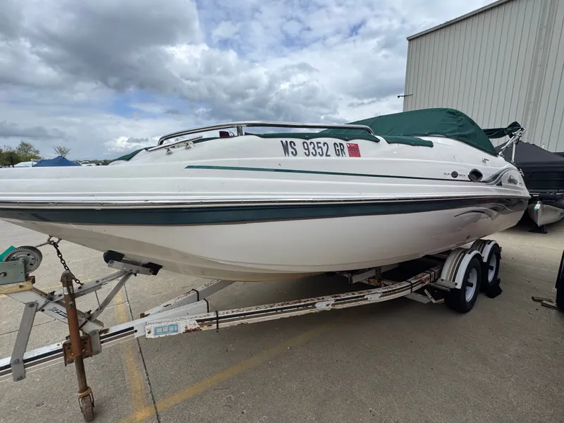 The Image of 2004 Hurricane SD187 boat on trailer, cloudy sky. - 1