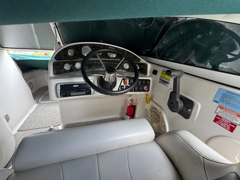 Slide: The Image of Interior view of a 2004 Hurricane SD187 boat cockpit with steering and instruments. - 5