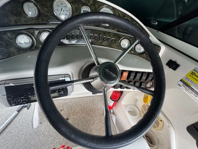 Slide: The Image of Steering wheel and dashboard of a 2004 Hurricane SD187 boat. - 6