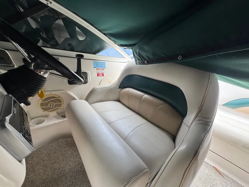 Slide: The Image of Interior of a 2004 Hurricane SD187 boat with steering wheel and bench seat. - 7