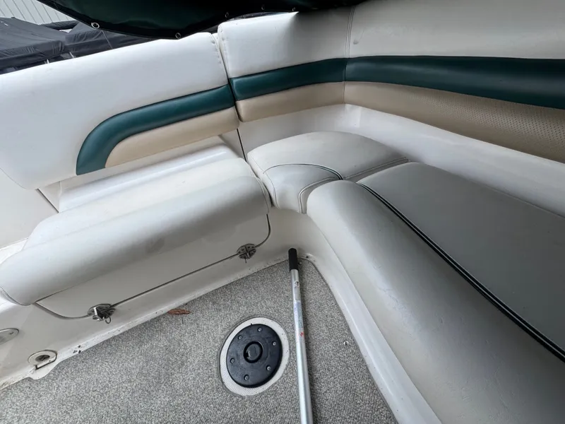 Slide: The Image of Interior of a 2004 Hurricane SD187 boat with cushioned seating. - 8