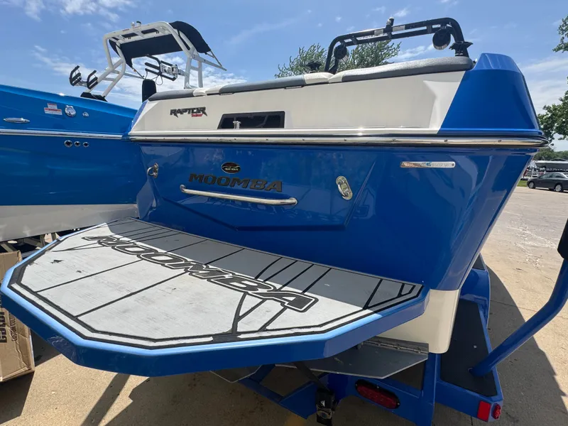 Slide: The Image of 2018 Moomba Max boat with blue rear and platform. - 11