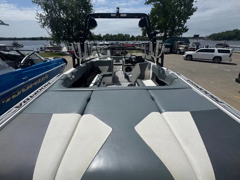 Slide: The Image of 2018 Moomba Max boat at dock with gray seating. - 13