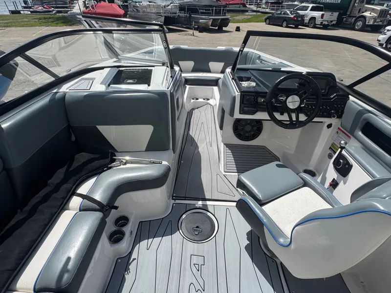 Slide: The Image of Interior of a 2018 Moomba Max boat with gray seating. - 17
