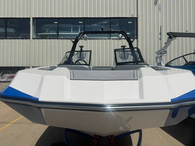 Slide: The Image of 2018 Moomba Max boat parked in front of a building. - 3