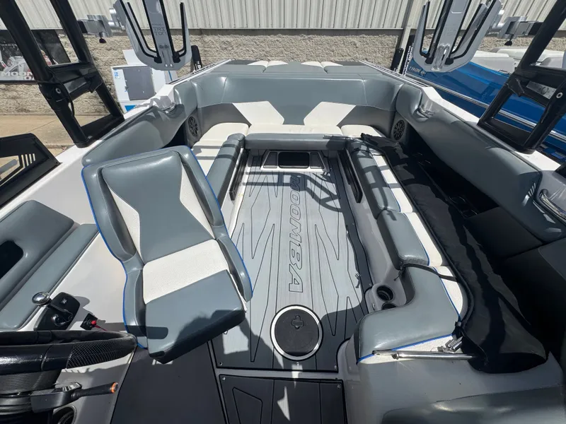 Slide: The Image of Interior of a 2018 Moomba Max boat with gray seating. - 6