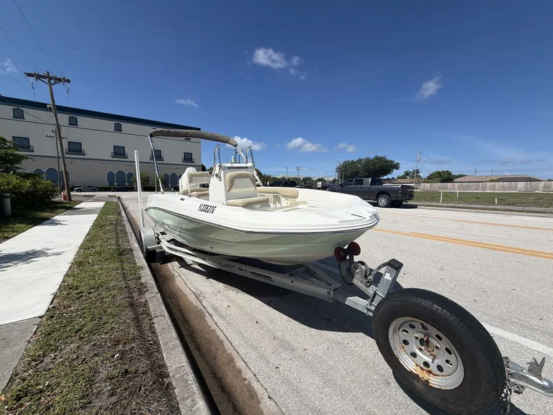 Slide: The Image of 2019 Stingray 186 boat on trailer, sunny day. - 11