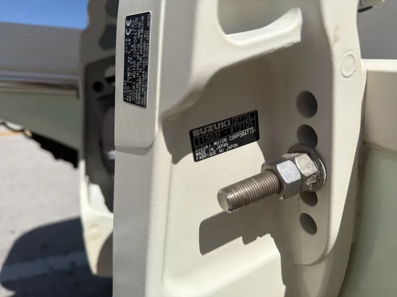 Slide: The Image of Close-up of Suzuki engine part on a 2019 Stingray 186 boat. - 12