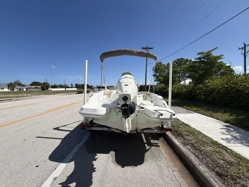Slide: The Image of 2019 Stingray 186 boat on trailer, sunny day. - 16