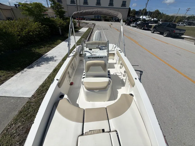 Slide: The Image of 2019 Stingray 186 boat with open cabin and seating area. - 17