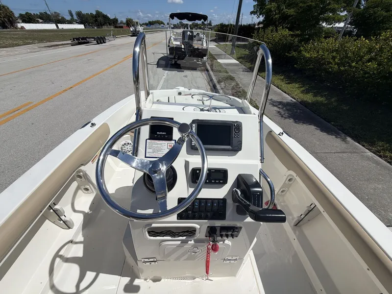 Slide: The Image of Interior view of a 2019 Stingray 186 boat with steering console. - 19