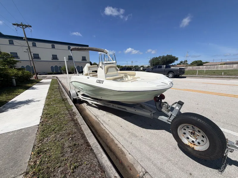 Slide: The Image of 2019 Stingray 186 boat on trailer in urban setting. - 3
