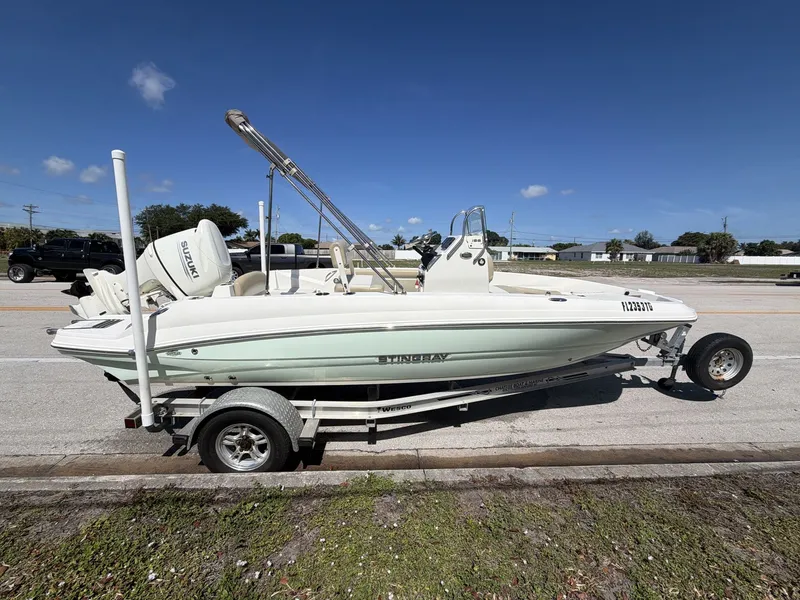 Slide: The Image of 2019 Stingray 186 boat on trailer, Suzuki engine, sunny day. - 4