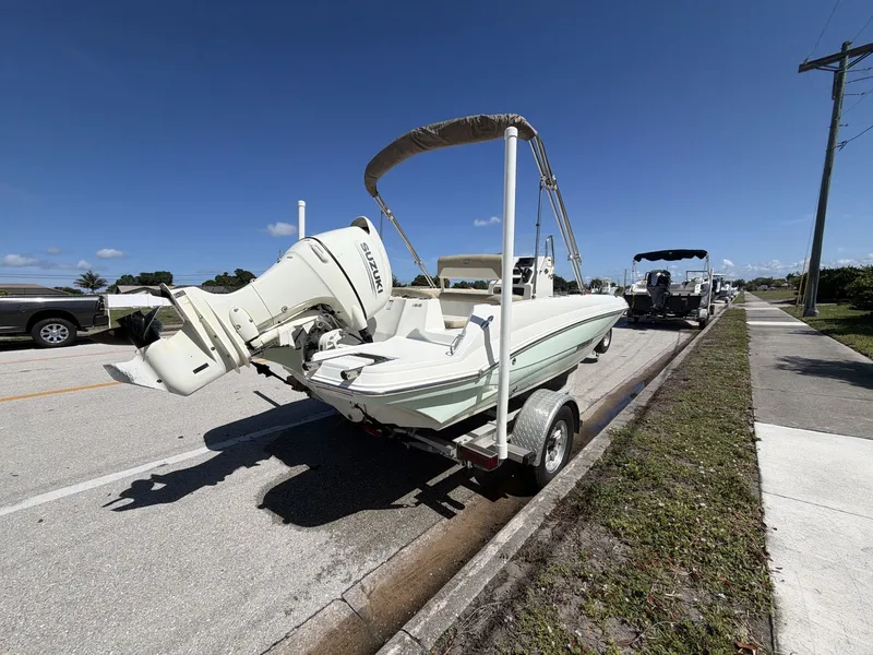 Slide: The Image of 2019 Stingray 186 boat with Suzuki outboard motor on trailer. - 5