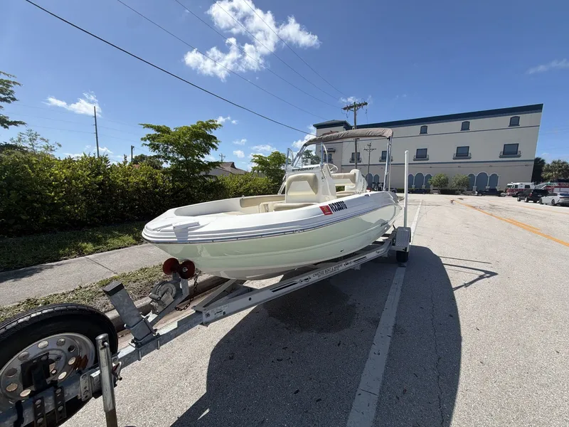 Slide: The Image of 2019 Stingray 186 boat on trailer under sunny skies. - 6