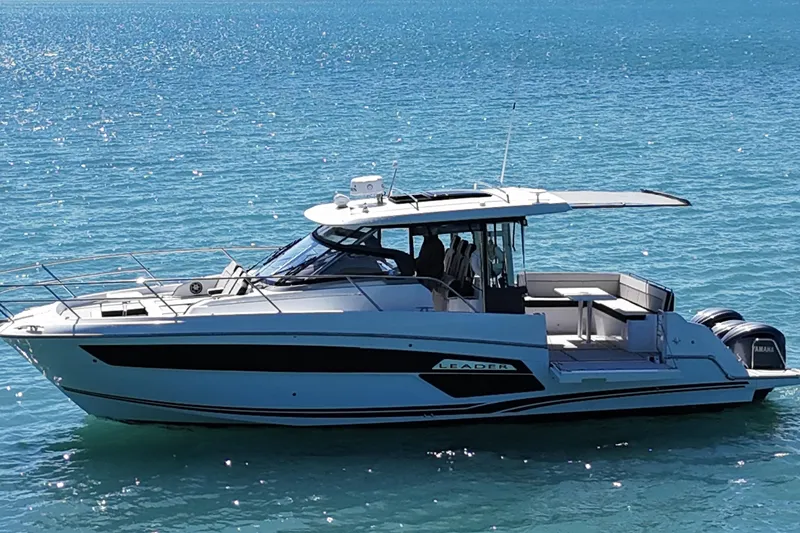 The Image of 2023 Jeanneau Leader 12.5 WA boat cruising on clear blue water. - 0