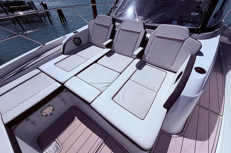 Slide: The Image of Luxurious seating on 2023 Jeanneau Leader 12.5 WA boat, featuring comfortable cushions and sleek design. - 11