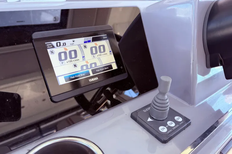 Slide: The Image of Dashboard of 2023 Jeanneau Leader 12.5 WA with Yamaha display and joystick controls. - 14