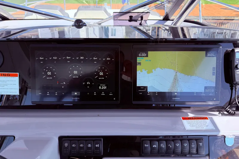 Slide: The Image of Dashboard of 2023 Jeanneau Leader 12.5 WA with Garmin navigation displays. - 16