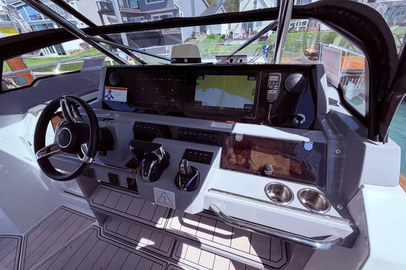 Slide: The Image of Cockpit of 2023 Jeanneau Leader 12.5 WA with modern navigation equipment and controls. - 18