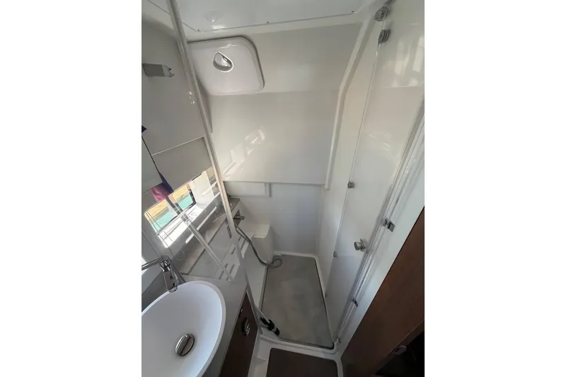 Slide: The Image of 2023 Jeanneau Leader 12.5 WA bathroom with modern fixtures and compact design. - 35