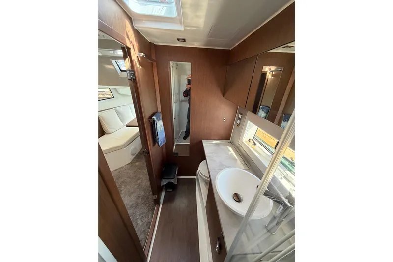 Slide: The Image of Interior of 2023 Jeanneau Leader 12.5 WA yacht, featuring modern bathroom and cozy cabin. - 36