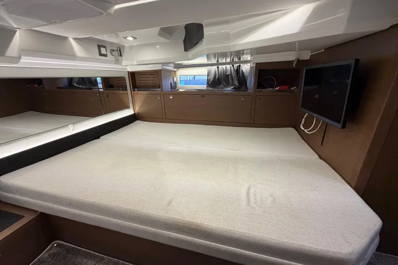 Slide: The Image of Interior cabin of 2023 Jeanneau Leader 12.5 WA with bed and TV. - 39