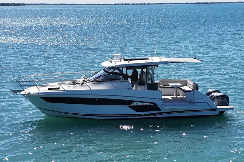 Slide: The Image of 2023 Jeanneau Leader 12.5 WA boat cruising on clear blue water. - 46