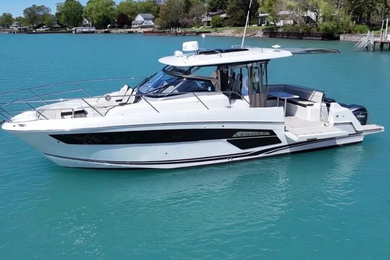 Slide: The Image of 2023 Jeanneau Leader 12.5 WA boat on turquoise water, showcasing sleek design and modern features. - 7