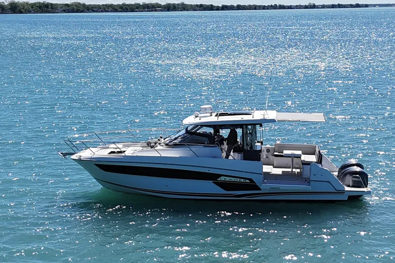 Slide: The Image of 2023 Jeanneau Leader 12.5 WA boat cruising on sparkling blue water. - 8