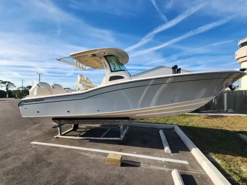 Slide: The Image of 2026 Grady-White 281 Coastal Explorer on a parking lot. - 2