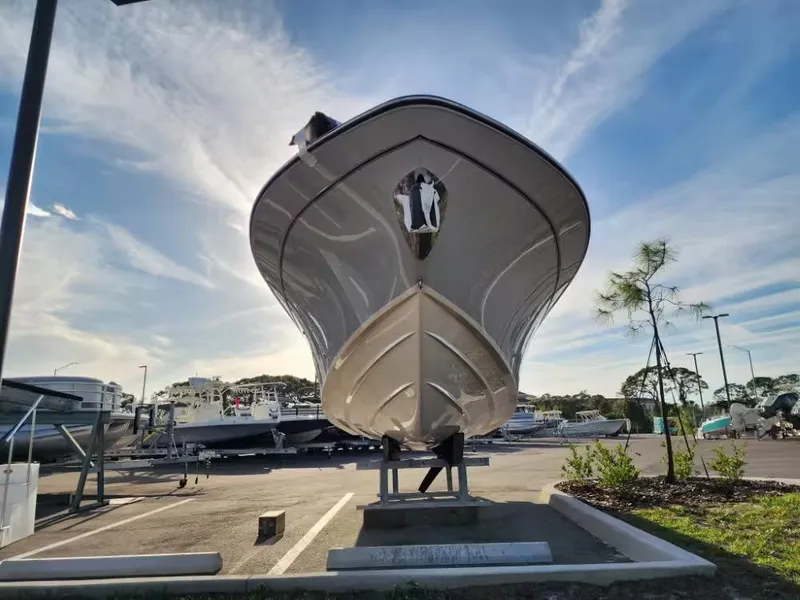Slide: The Image of Grady-White 281 Coastal Explorer 2026 on a parking lot under sunny skies. - 4