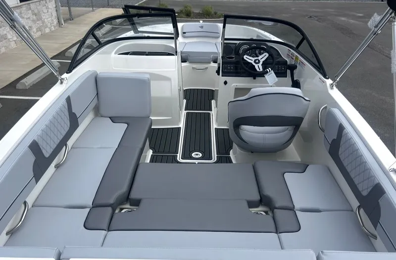 Slide: The Image of Interior of 2026 Bayliner VR4 Bowrider OB with gray seating. - 11