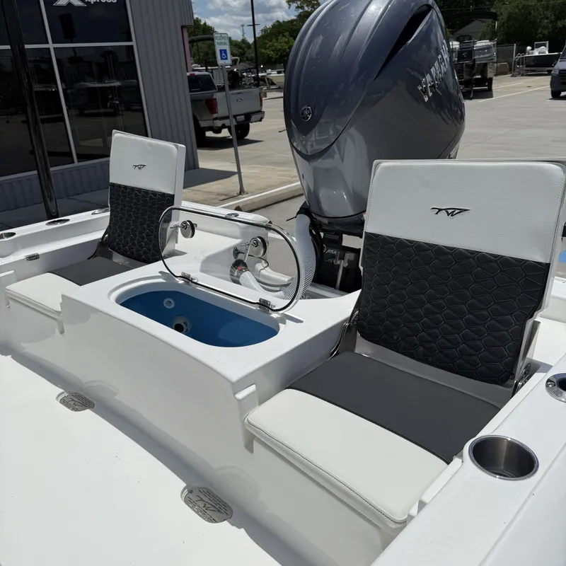 Slide: The Image of 2026 Tidewater 2110 Bay Max boat with modern seating and engine. - 22