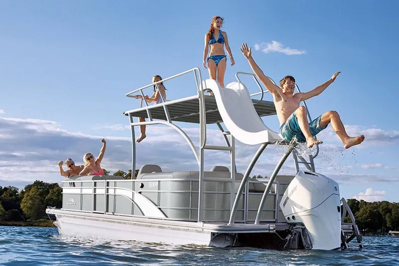 Slide: The Image of 2023 Bennington 20 SXSB pontoon boat with slide on the water. - 12