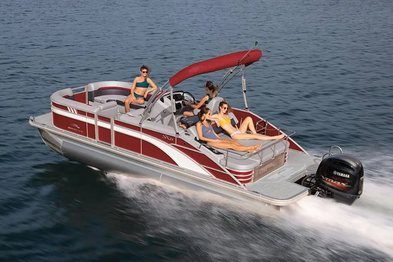 Slide: The Image of 2023 Bennington 20 SXSB pontoon boat on water with passengers. - 2