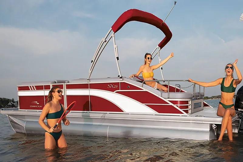 Slide: The Image of Women enjoying the 2023 Bennington 20 SXSB pontoon boat in the water. - 4