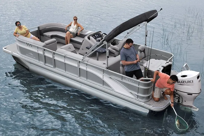 Slide: The Image of 2023 Bennington 20 SXSB pontoon boat on water with passengers. - 7