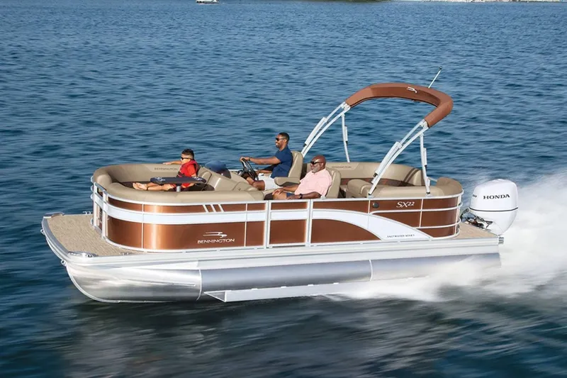 Slide: The Image of Bennington 20 SXSB 2023 pontoon boat cruising on water. - 9