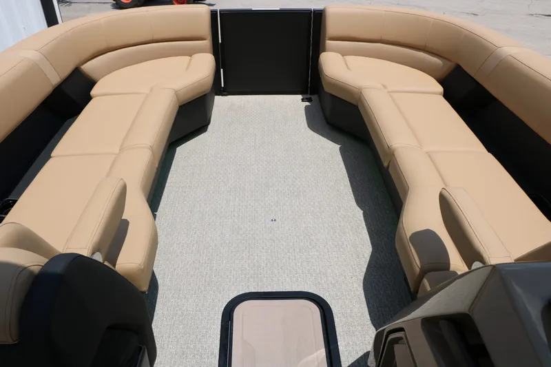 Slide: The Image of Interior of 2026 Evotti 725 CS Arch Tri Toon with beige seating. - 31