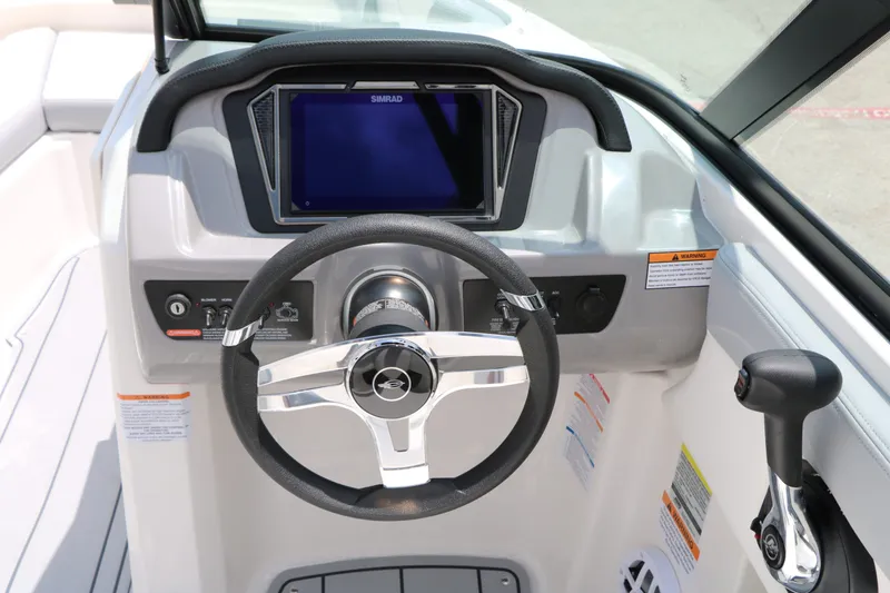 Slide: The Image of Chaparral 21 SSi 2026 helm with Simrad display and controls. - 36