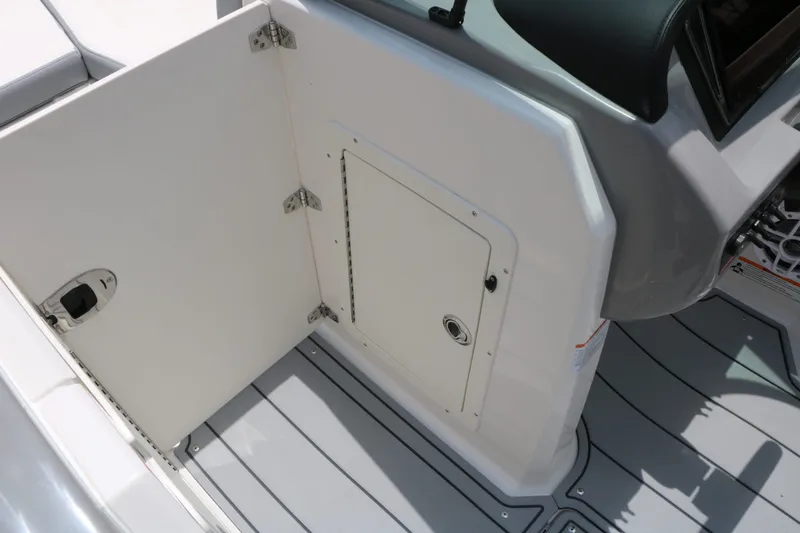 Slide: The Image of Interior of 2026 Chaparral 21 SSi featuring storage compartment. - 43
